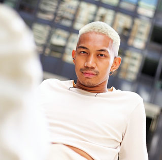 photo of a young, biracial man